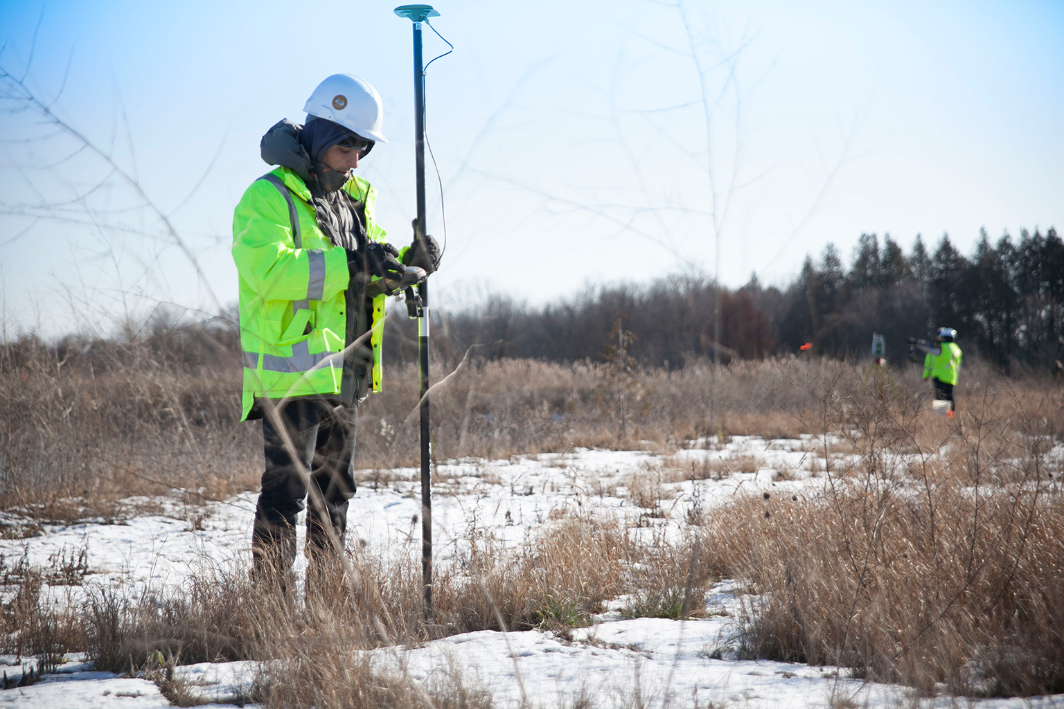 Surveyor working with precision equipment